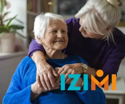 oudere dame met dochter en Izimi logo